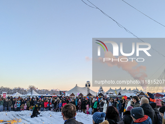 A snow-covered scene at the Winter Tollwood Festival on December 3, 2023, in Munich, Germany, shows the event's focus on art, culture, and s...