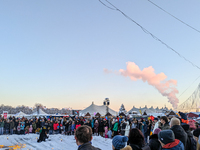 A snow-covered scene at the Winter Tollwood Festival on December 3, 2023, in Munich, Germany, shows the event's focus on art, culture, and s...