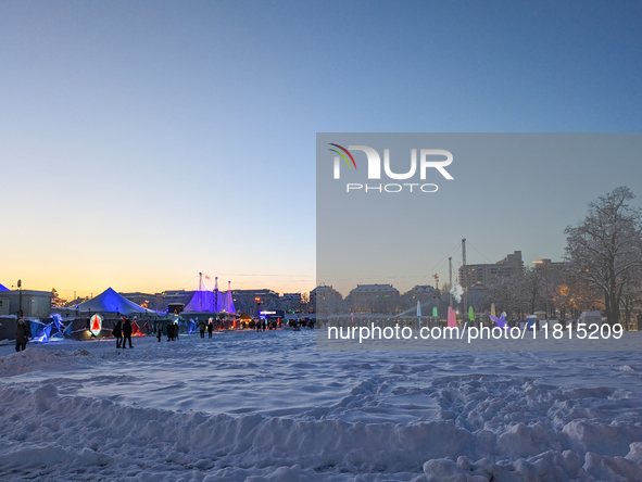 A snow-covered scene at the Winter Tollwood Festival on December 3, 2023, in Munich, Germany, shows the event's focus on art, culture, and s...