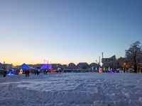 A snow-covered scene at the Winter Tollwood Festival on December 3, 2023, in Munich, Germany, shows the event's focus on art, culture, and s...