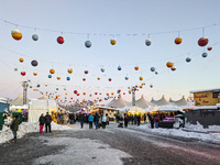 A snow-covered scene at the Winter Tollwood Festival on December 3, 2023, in Munich, Germany, shows the event's focus on art, culture, and s...