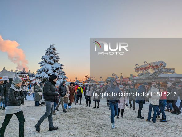 A snow-covered scene at the Winter Tollwood Festival on December 3, 2023, in Munich, Germany, shows the event's focus on art, culture, and s...