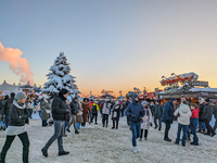 A snow-covered scene at the Winter Tollwood Festival on December 3, 2023, in Munich, Germany, shows the event's focus on art, culture, and s...