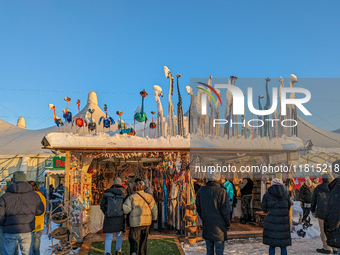 A snow-covered scene at the Winter Tollwood Festival on December 3, 2023, in Munich, Germany, shows the event's focus on art, culture, and s...