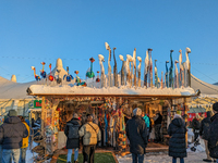 A snow-covered scene at the Winter Tollwood Festival on December 3, 2023, in Munich, Germany, shows the event's focus on art, culture, and s...