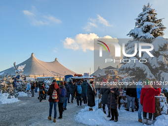 A snow-covered scene at the Winter Tollwood Festival on December 3, 2023, in Munich, Germany, shows the event's focus on art, culture, and s...