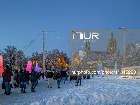 A snow-covered scene at the Winter Tollwood Festival on December 3, 2023, in Munich, Germany, shows the event's focus on art, culture, and s...