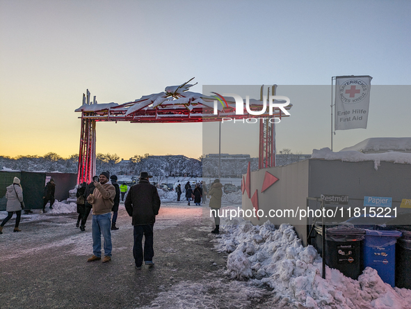 A snow-covered scene at the Winter Tollwood Festival on December 3, 2023, in Munich, Germany, shows the event's focus on art, culture, and s...