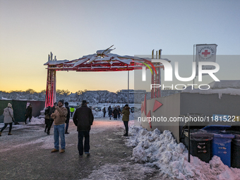 A snow-covered scene at the Winter Tollwood Festival on December 3, 2023, in Munich, Germany, shows the event's focus on art, culture, and s...