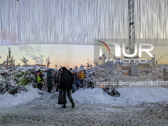 A snow-covered scene at the Winter Tollwood Festival on December 3, 2023, in Munich, Germany, shows the event's focus on art, culture, and s...