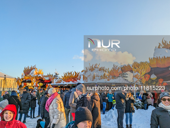 A snow-covered scene at the Winter Tollwood Festival on December 3, 2023, in Munich, Germany, shows the event's focus on art, culture, and s...