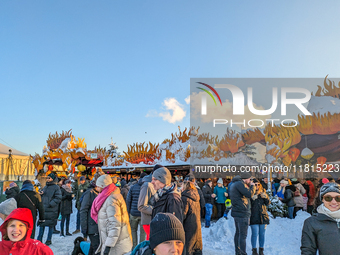 A snow-covered scene at the Winter Tollwood Festival on December 3, 2023, in Munich, Germany, shows the event's focus on art, culture, and s...