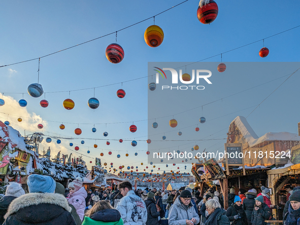 A snow-covered scene at the Winter Tollwood Festival on December 3, 2023, in Munich, Germany, shows the event's focus on art, culture, and s...