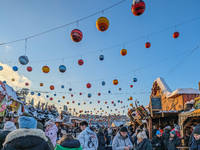 A snow-covered scene at the Winter Tollwood Festival on December 3, 2023, in Munich, Germany, shows the event's focus on art, culture, and s...