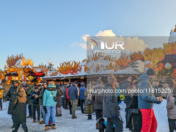 A snow-covered scene at the Winter Tollwood Festival on December 3, 2023, in Munich, Germany, shows the event's focus on art, culture, and s...