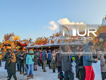 A snow-covered scene at the Winter Tollwood Festival on December 3, 2023, in Munich, Germany, shows the event's focus on art, culture, and s...