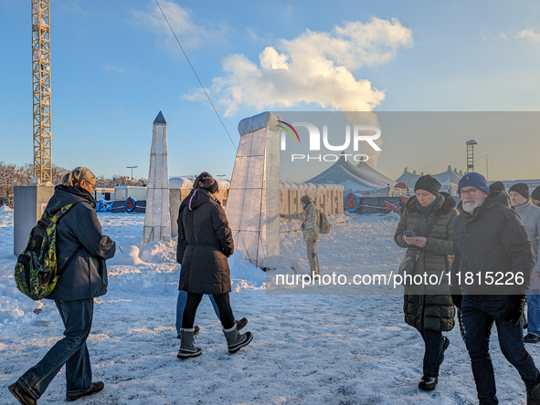 A snow-covered scene at the Winter Tollwood Festival on December 3, 2023, in Munich, Germany, shows the event's focus on art, culture, and s...