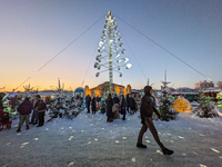 A snow-covered scene at the Winter Tollwood Festival on December 3, 2023, in Munich, Germany, shows the event's focus on art, culture, and s...