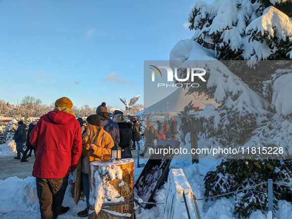 A snow-covered scene at the Winter Tollwood Festival on December 3, 2023, in Munich, Germany, shows the event's focus on art, culture, and s...