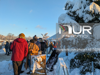 A snow-covered scene at the Winter Tollwood Festival on December 3, 2023, in Munich, Germany, shows the event's focus on art, culture, and s...