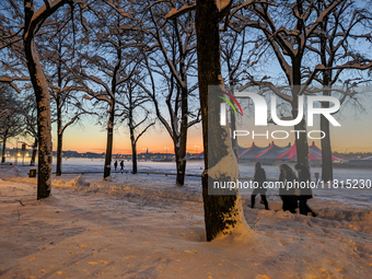 A snow-covered scene at the Winter Tollwood Festival on December 3, 2023, in Munich, Germany, shows the event's focus on art, culture, and s...