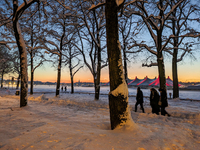 A snow-covered scene at the Winter Tollwood Festival on December 3, 2023, in Munich, Germany, shows the event's focus on art, culture, and s...