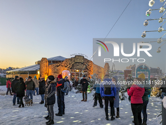 A snow-covered scene at the Winter Tollwood Festival on December 3, 2023, in Munich, Germany, shows the event's focus on art, culture, and s...