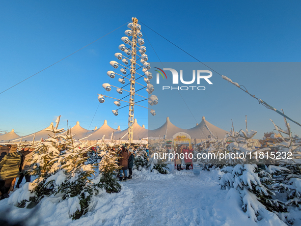 A snow-covered scene at the Winter Tollwood Festival on December 3, 2023, in Munich, Germany, shows the event's focus on art, culture, and s...