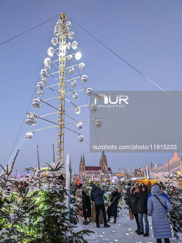 A snow-covered scene at the Winter Tollwood Festival on December 3, 2023, in Munich, Germany, shows the event's focus on art, culture, and s...