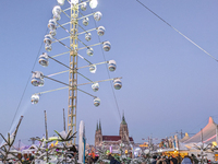 A snow-covered scene at the Winter Tollwood Festival on December 3, 2023, in Munich, Germany, shows the event's focus on art, culture, and s...