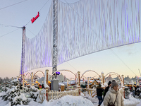 A snow-covered scene at the Winter Tollwood Festival on December 3, 2023, in Munich, Germany, shows the event's focus on art, culture, and s...