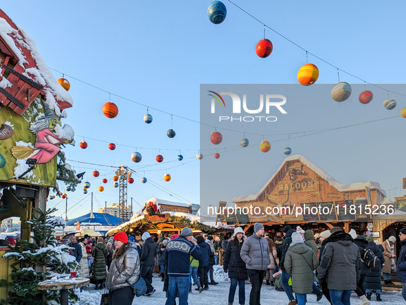 A snow-covered scene at the Winter Tollwood Festival on December 3, 2023, in Munich, Germany, shows the event's focus on art, culture, and s...