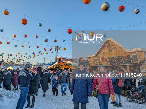 A snow-covered scene at the Winter Tollwood Festival on December 3, 2023, in Munich, Germany, shows the event's focus on art, culture, and s...