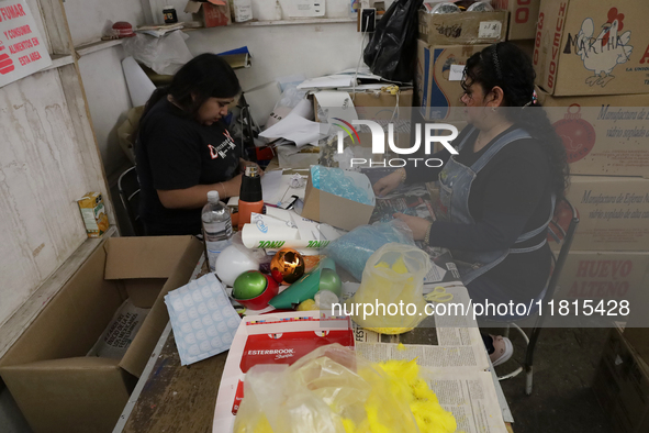 Decoration and cutting of handcrafted balls made of blown glass for sale in the Tlahuac municipality, Mexico City, on Christmas Eve and New...