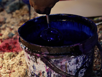 A painting of handcrafted spheres is created in a cooperative workshop made of blown glass for sale in the Tlahuac municipality, Mexico City...