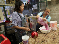 Handcrafted balls made of blown glass are decorated for sale in the Tlahuac municipality, Mexico City, on Christmas Eve and New Year in Mexi...