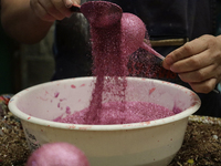 Handcrafted balls made of blown glass are decorated for sale in the Tlahuac municipality, Mexico City, on Christmas Eve and New Year in Mexi...