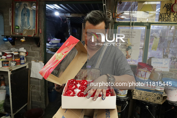 Handcrafted spheres made of blown glass are stored in a cooperative workshop for sale in the Tlahuac municipality, Mexico City, on Christmas...