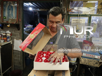 Handcrafted spheres made of blown glass are stored in a cooperative workshop for sale in the Tlahuac municipality, Mexico City, on Christmas...