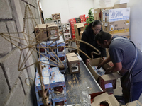 Inside a workshop and cooperative in the Tlahuac municipality, Mexico City, artisans make spheres from blown glass for sale on Christmas and...