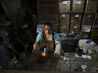 Josefina Aguilar, an industrial biochemist, makes handcrafted balls made of blown glass for sale in the Tlahuac municipality, Mexico City, o...