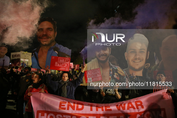 People attend a protest march in support of the hostages kidnapped during the deadly October 7, 2023, attack by Hamas, marking a year since...