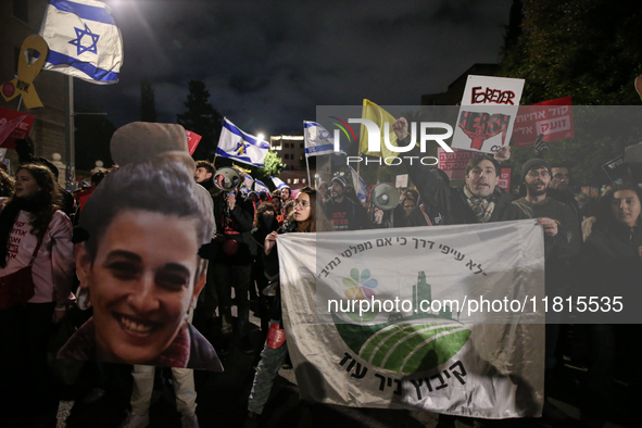 People attend a protest march in support of the hostages kidnapped during the deadly October 7, 2023, attack by Hamas, marking a year since...