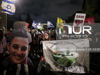 People attend a protest march in support of the hostages kidnapped during the deadly October 7, 2023, attack by Hamas, marking a year since...