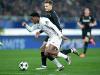 Jonathan David of LOSC Lille and Stefan Posch of Bologna FC compete for the ball during the UEFA Champions League 2024/25 League Phase MD5 m...