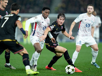 Jonathan David of LOSC Lille and Giovanni Fabbian of Bologna FC compete for the ball during the UEFA Champions League 2024/25 League Phase M...