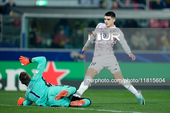 Lukasz Skorupski of Bologna FC saves on Matias Fernandez-Pardo of LOSC Lille during the UEFA Champions League 2024/25 League Phase MD5 match...