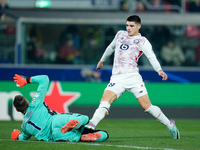 Lukasz Skorupski of Bologna FC saves on Matias Fernandez-Pardo of LOSC Lille during the UEFA Champions League 2024/25 League Phase MD5 match...