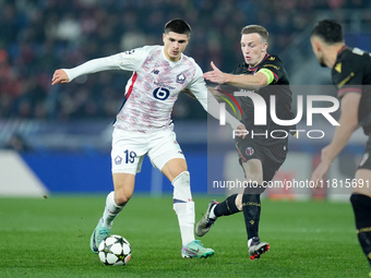 Matias Fernandez-Pardo of LOSC Lille and Lewis Ferguson of Bologna FC compete for the ball during the UEFA Champions League 2024/25 League P...