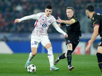 Matias Fernandez-Pardo of LOSC Lille and Lewis Ferguson of Bologna FC compete for the ball during the UEFA Champions League 2024/25 League P...